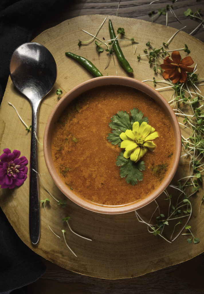 Mystic Thai Jamaica team of chefs and servers smiling in restaurant setting