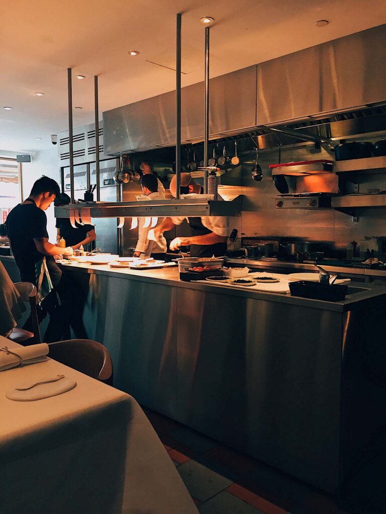 Mystic Thai Kingston restaurant interior with diners enjoying Thai and Indian fusion dishes