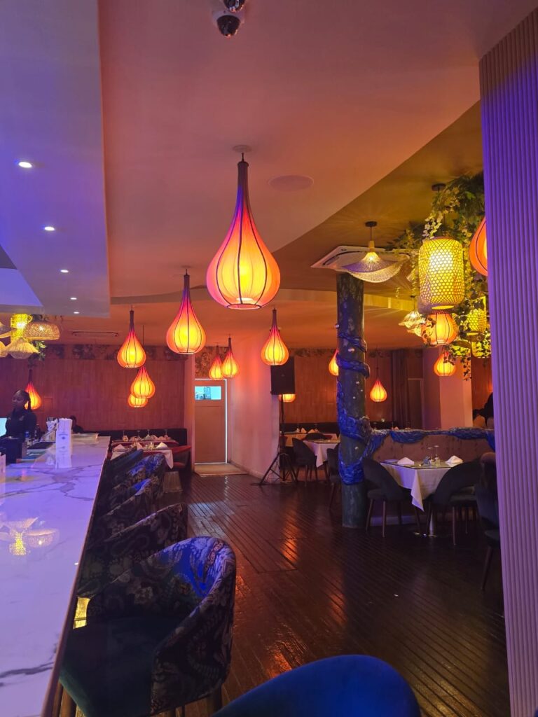 Mystic Thai Kingston restaurant interior with diners enjoying Thai and Indian fusion dishes